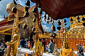 Chiang Mai - Wat Phra That Doi Suthep. The innercourtyard of the temple is filled with Buddha statues and other religious paraphenalia. 